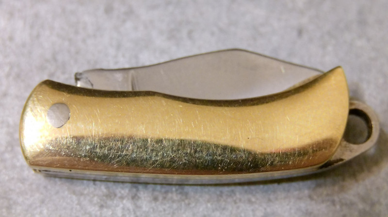 Складной нож с латунной рукоятью